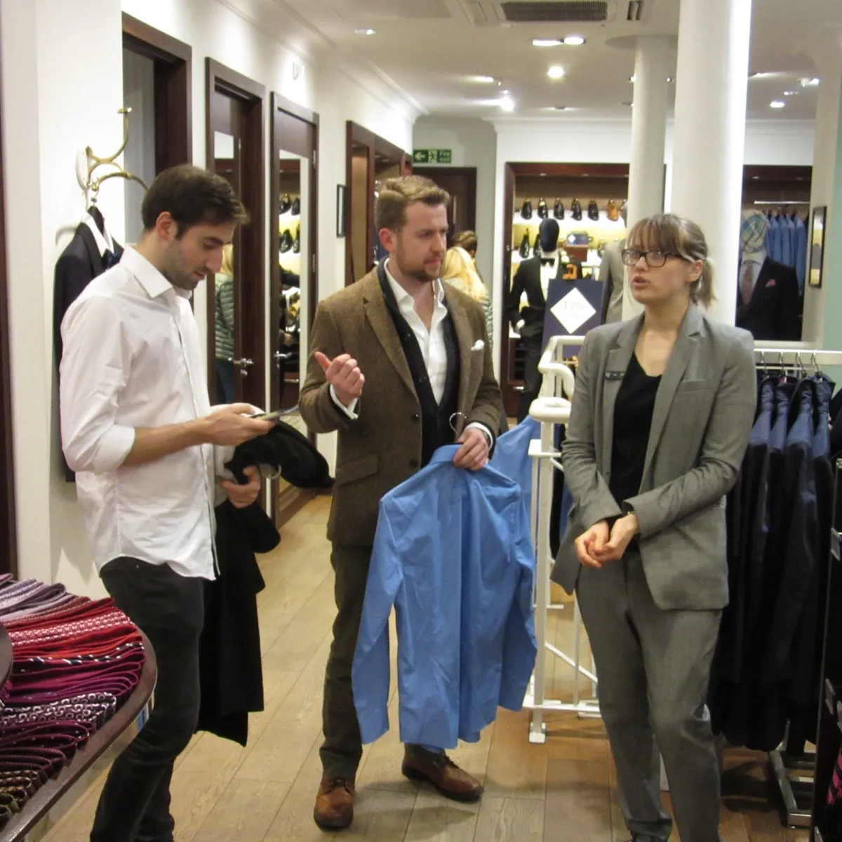 Rupert selecting clothing for his male client