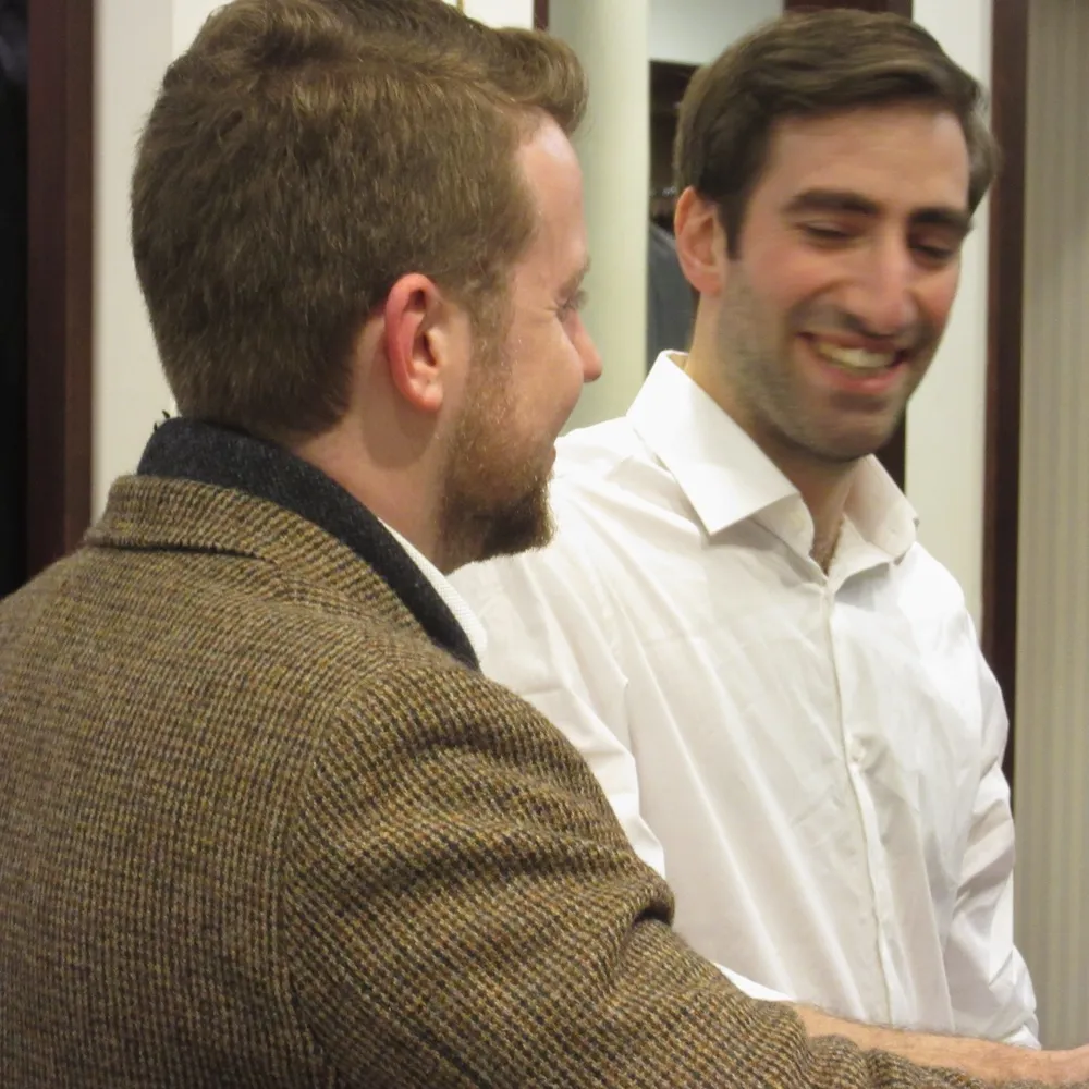 Rupert laughing with a client he's working with.